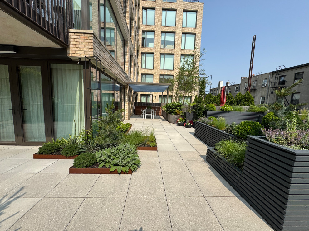A rooftop garden shaped by custom planters and strong geometry